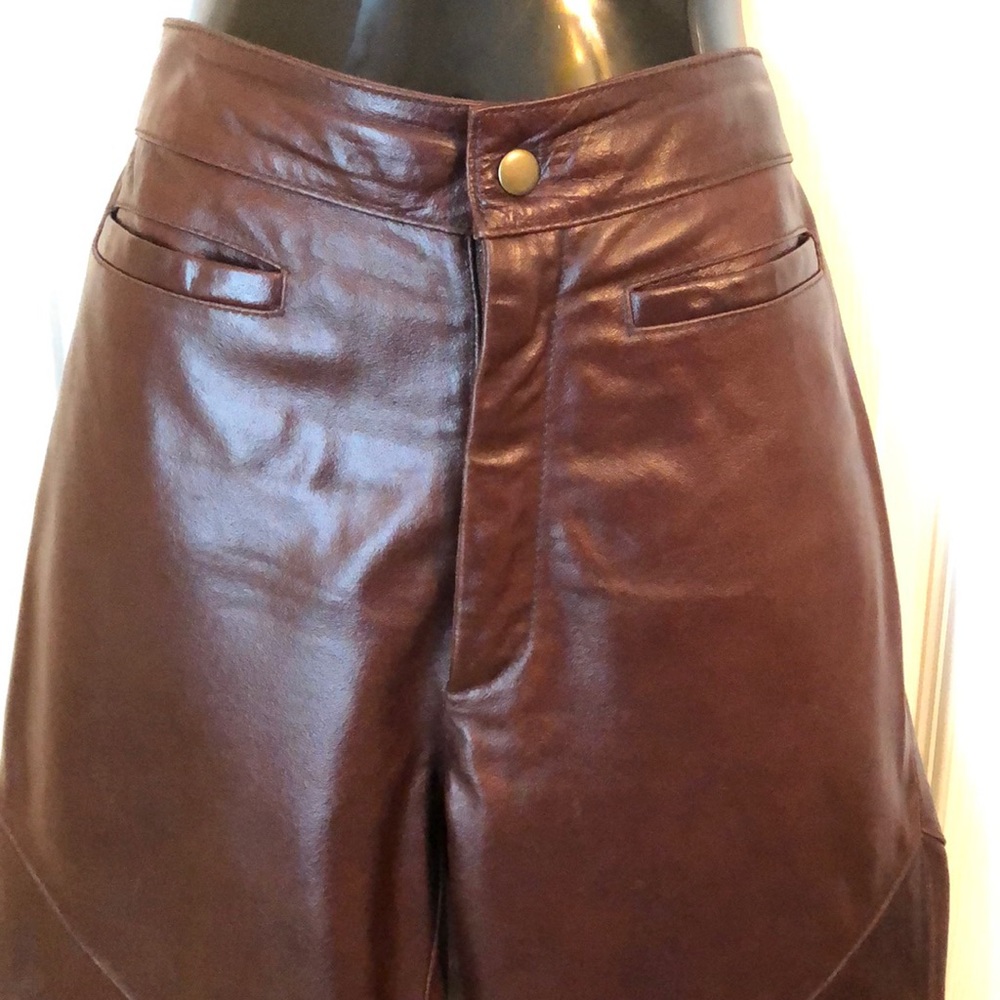 Maxima wine color genuine leather pants.